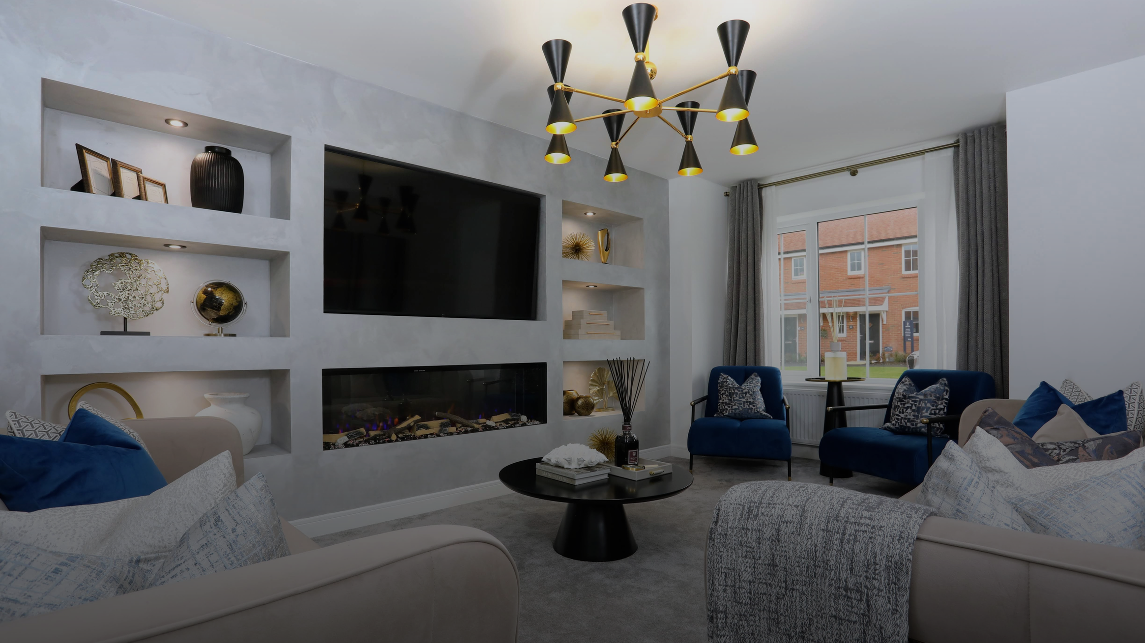 An elegant blue and gold living room designed by NateBel Interiors